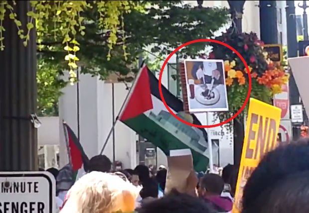 Circled in red: Poster depicting a Jew eating a gentile child with a cup of blood on the side.