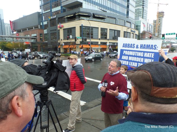 Rally organizer Rob Jacobs being interviewed by local news media.